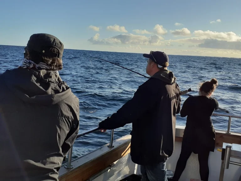 Home Anglers fishing at the rail of Saint Colette II