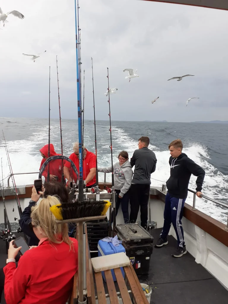 Gulls following the boat as anglers fish