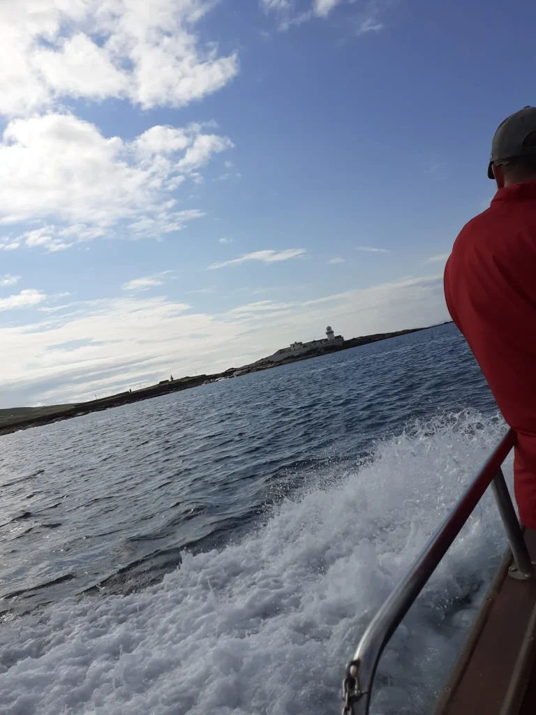 Home Headland and lighthouse seen from the boat