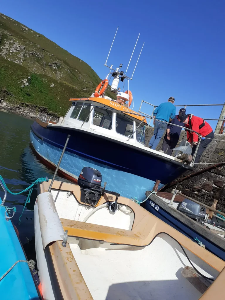 Saint Colette II at the marina under a blue sky