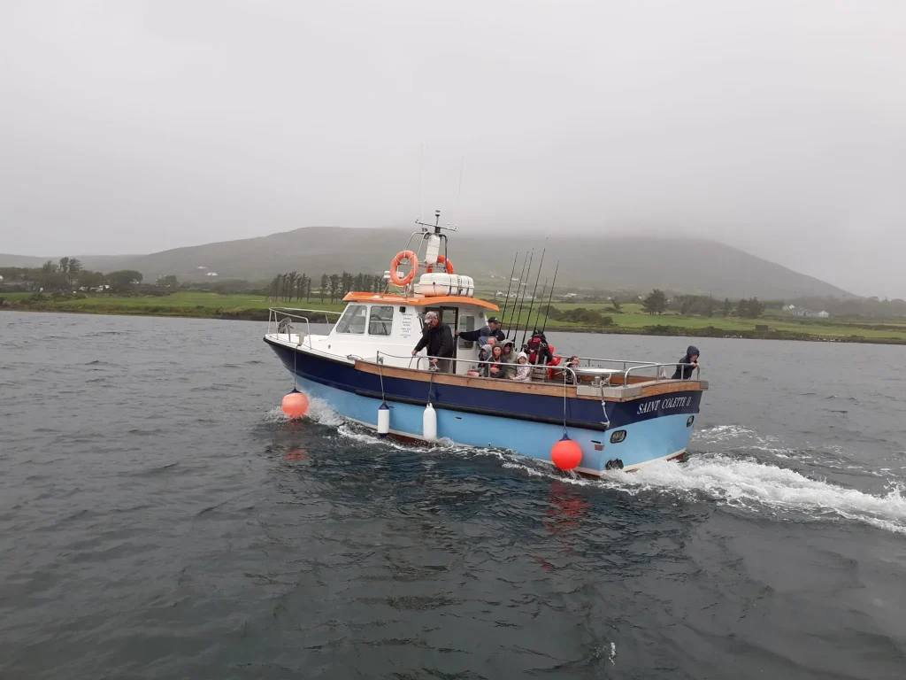 Saint Colette II under way with mountains behind